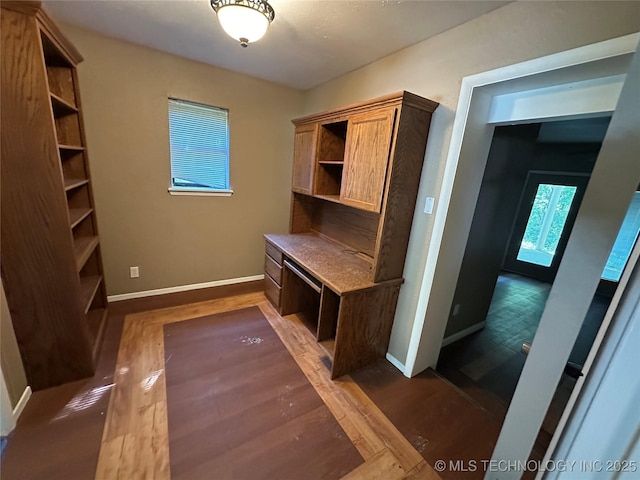 905 Brookside Dr, Durant, OK 74701 - mudroom with baseboards and dark wood-type flooring