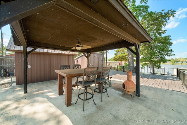 1557 110th St NW, Grove, OK 74344 - view of patio / terrace with outdoor dining space, ceiling fan, and a water view