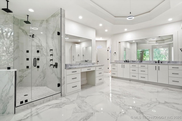 5011 E 84th St, Tulsa, OK 74137 - bathroom featuring a marble finish shower, two vanities, recessed lighting, a tray ceiling, and marble tiled floors