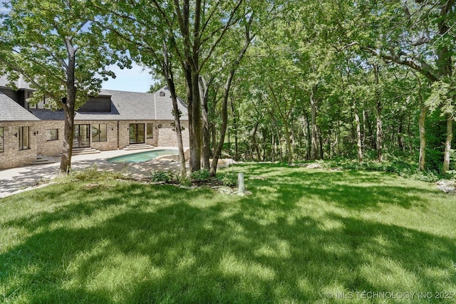 5011 E 84th St, Tulsa, OK 74137 - view of green lawn featuring a patio area