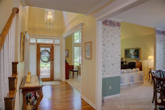 5140 E 107th Pl, Tulsa, OK 74137 - entrance foyer featuring a chandelier, ornamental molding, wood finished floors, baseboards, and a towering ceiling