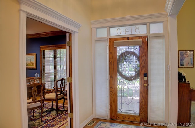 5140 E 107th Pl, Tulsa, OK 74137 - entryway featuring healthy amount of natural light, baseboards, and wood finished floors