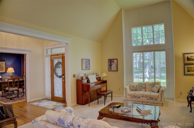 5140 E 107th Pl, Tulsa, OK 74137 - living room featuring high vaulted ceiling, plenty of natural light, and baseboards