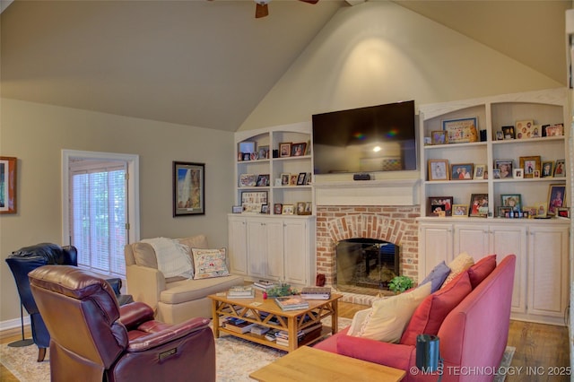 5140 E 107th Pl, Tulsa, OK 74137 - living area with wood finished floors, ceiling fan, a brick fireplace, and high vaulted ceiling