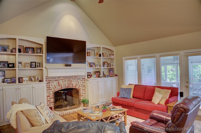 5140 E 107th Pl, Tulsa, OK 74137 - living room with high vaulted ceiling, built in shelves, a brick fireplace, and wood finished floors