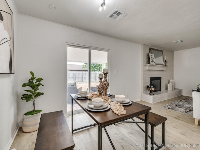 5015 S 89th E Pl, Tulsa, OK 74145 - living room featuring light wood-type flooring and a brick fireplace