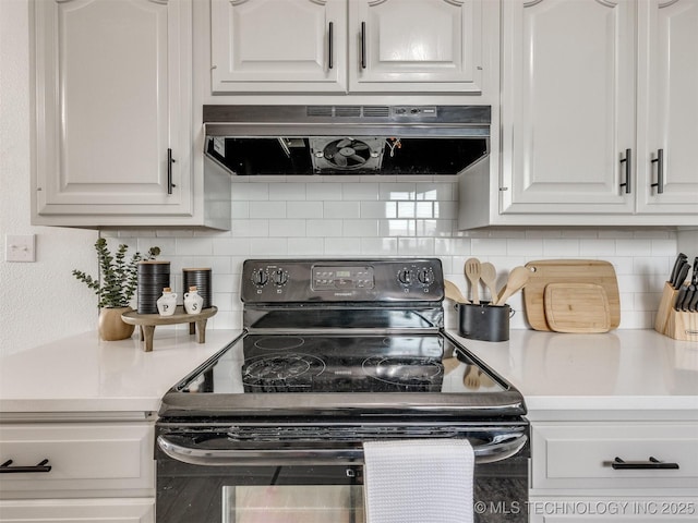 5015 S 89th E Pl, Tulsa, OK 74145 - kitchen featuring black range with electric cooktop, ventilation hood, white cabinetry, and light countertops