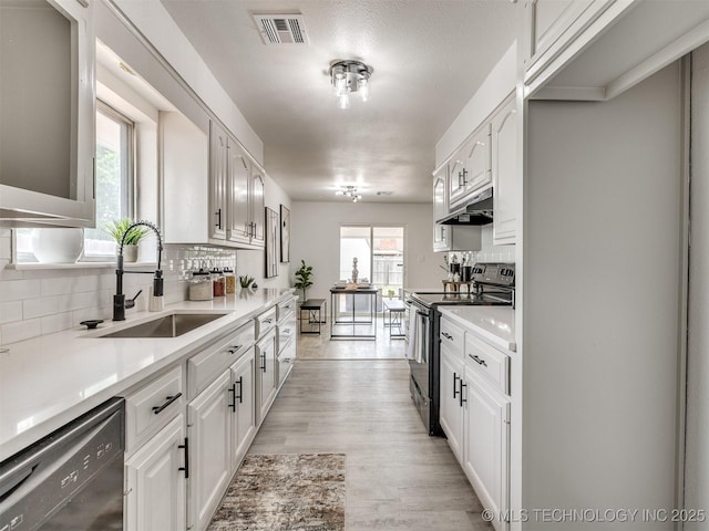 5015 S 89th E Pl, Tulsa, OK 74145 - kitchen featuring electric range, dishwasher, backsplash, under cabinet range hood, and white cabinetry