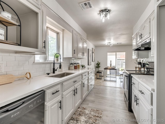5015 S 89th E Pl, Tulsa, OK 74145 - kitchen with dishwasher, electric range, under cabinet range hood, and white cabinets