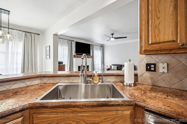 3305 N Oak Ave, Broken Arrow, OK 74012 - kitchen with brown cabinetry, decorative backsplash, open floor plan, dishwasher, and a ceiling fan