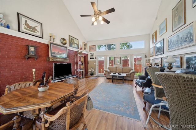 2403 S Troost Ave, Tulsa, OK 74114 - living area featuring high vaulted ceiling, ceiling fan, and wood finished floors