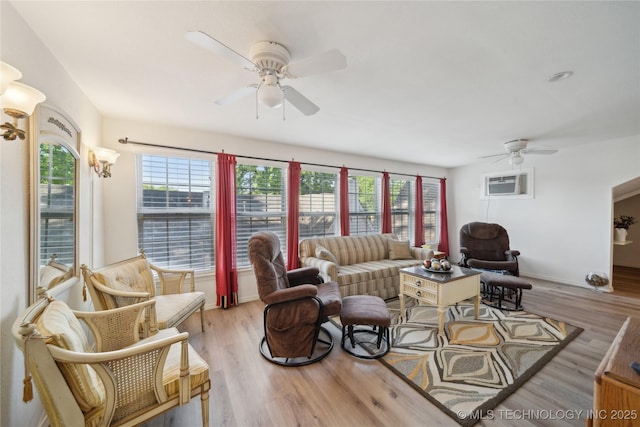 2403 S Troost Ave, Tulsa, OK 74114 - living room with a ceiling fan, healthy amount of natural light, and light wood-style flooring