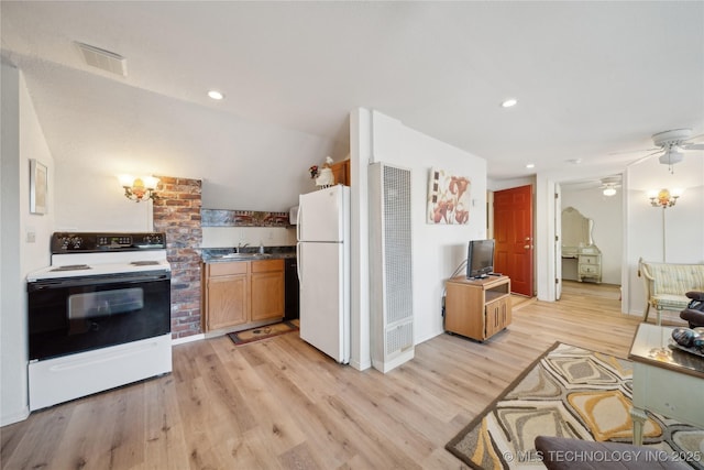 2403 S Troost Ave, Tulsa, OK 74114 - kitchen featuring white appliances, a heating unit, a sink, light wood finished floors, and a ceiling fan
