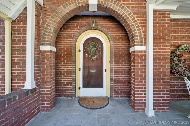 2403 S Troost Ave, Tulsa, OK 74114 - property entrance featuring brick siding