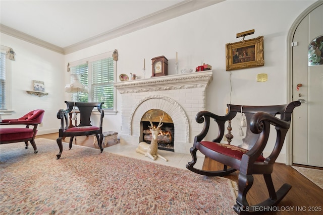 2403 S Troost Ave, Tulsa, OK 74114 - living area featuring crown molding, a brick fireplace, and wood finished floors