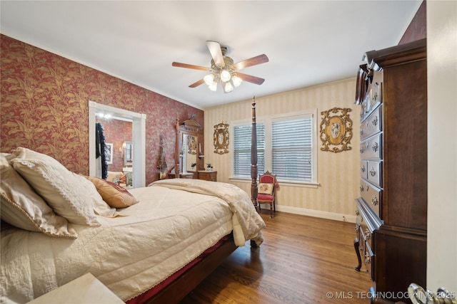 2403 S Troost Ave, Tulsa, OK 74114 - bedroom featuring wallpapered walls, wood finished floors, baseboards, ornamental molding, and a ceiling fan