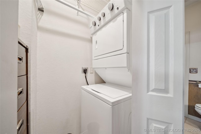 2403 S Troost Ave, Tulsa, OK 74114 - laundry area featuring stacked washer / dryer