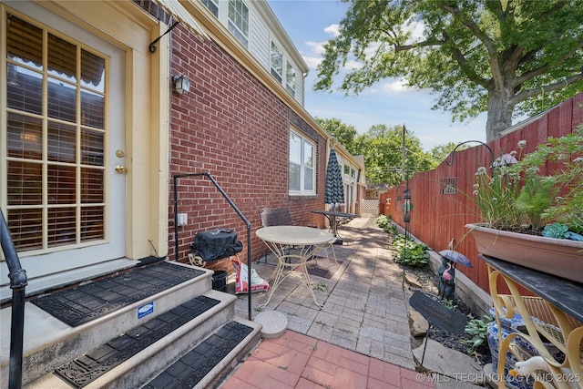2403 S Troost Ave, Tulsa, OK 74114 - fenced backyard featuring a patio area