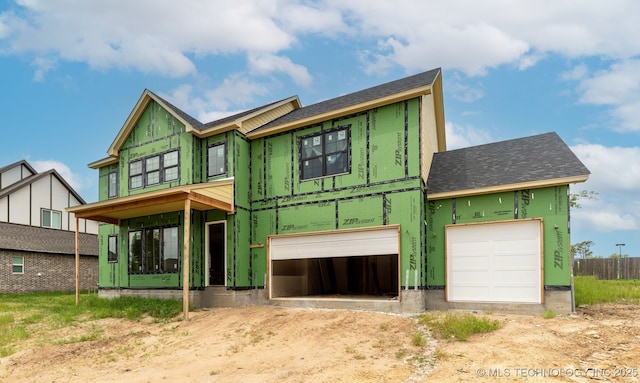 9518 N 143rd Ct E, Owasso, OK 74055 - unfinished property with an attached garage, roof with shingles, and driveway