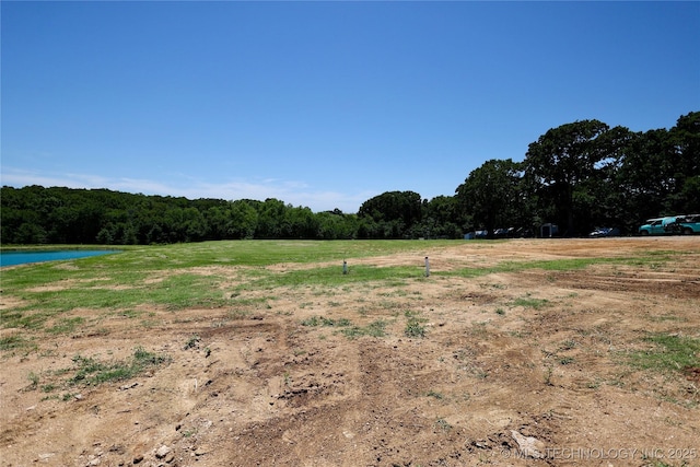 6854 Delores Dr, Sulphur, OK 73086 - view of tree filled area featuring a water view and a view of countryside