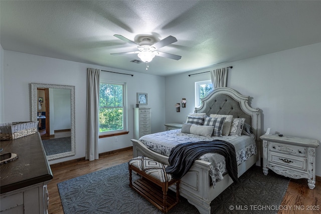 11787 S 4243rd Rd, Chelsea, OK 74016 - bedroom with wood finished floors, ceiling fan, a textured ceiling, and baseboards