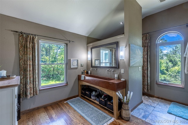 11787 S 4243rd Rd, Chelsea, OK 74016 - full bath with vanity, baseboards, vaulted ceiling, a textured wall, and wood finished floors