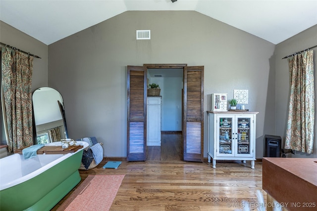 11787 S 4243rd Rd, Chelsea, OK 74016 - interior space featuring wood finished floors and high vaulted ceiling