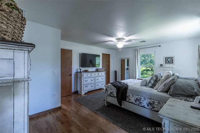 11787 S 4243rd Rd, Chelsea, OK 74016 - bedroom with dark wood-type flooring, baseboards, and a ceiling fan