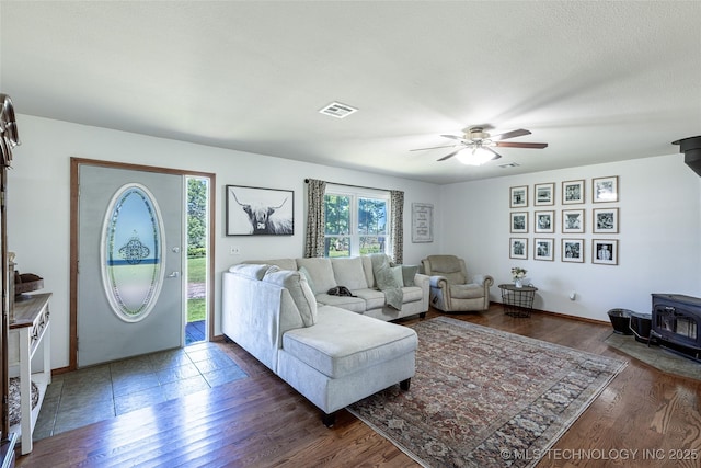 11787 S 4243rd Rd, Chelsea, OK 74016 - living room with a wood stove, ceiling fan, and wood finished floors