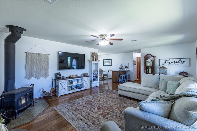 11787 S 4243rd Rd, Chelsea, OK 74016 - living room with a wood stove, a ceiling fan, and wood finished floors