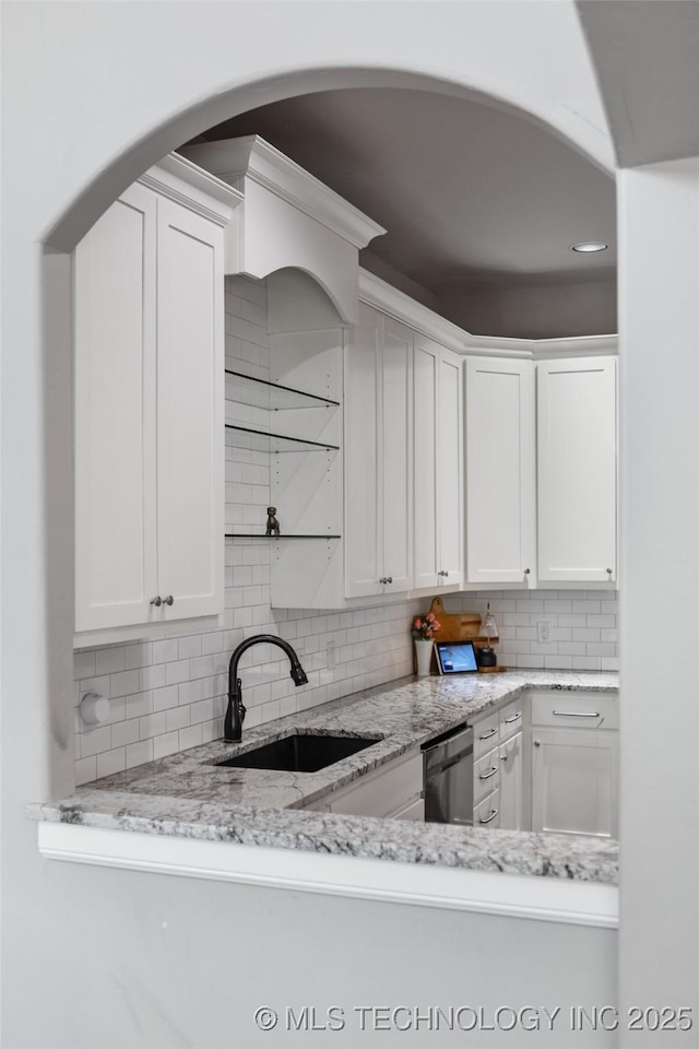 12014 S Kingston Pl, Tulsa, OK 74137 - kitchen with decorative backsplash, white cabinetry, dishwashing machine, light stone counters, and recessed lighting