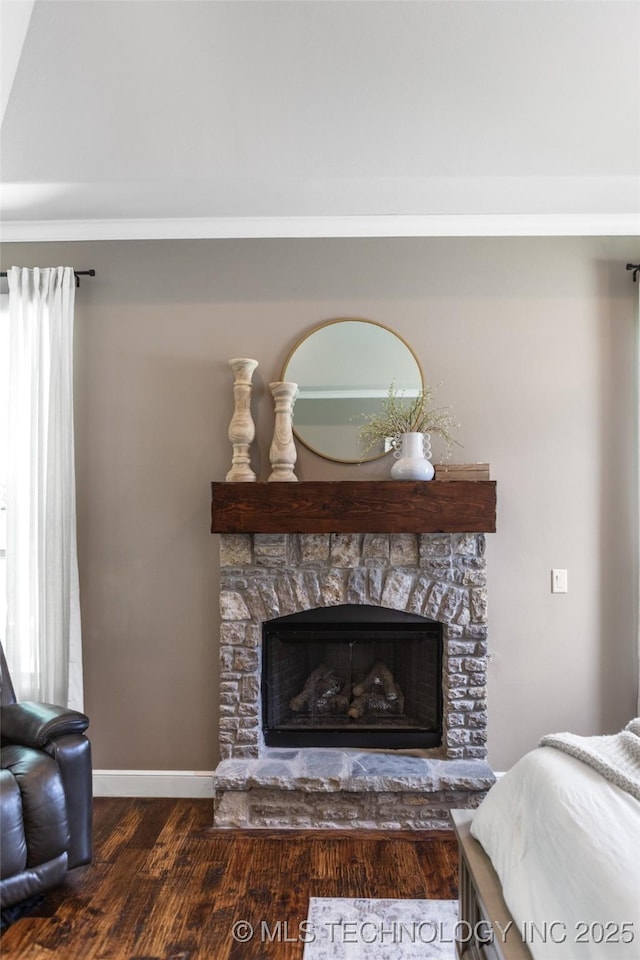 12014 S Kingston Pl, Tulsa, OK 74137 - bedroom featuring wood finished floors, baseboards, and a fireplace