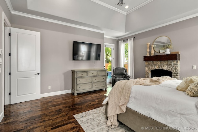 12014 S Kingston Pl, Tulsa, OK 74137 - bedroom featuring dark wood-type flooring, ornamental molding, recessed lighting, a tray ceiling, and a fireplace