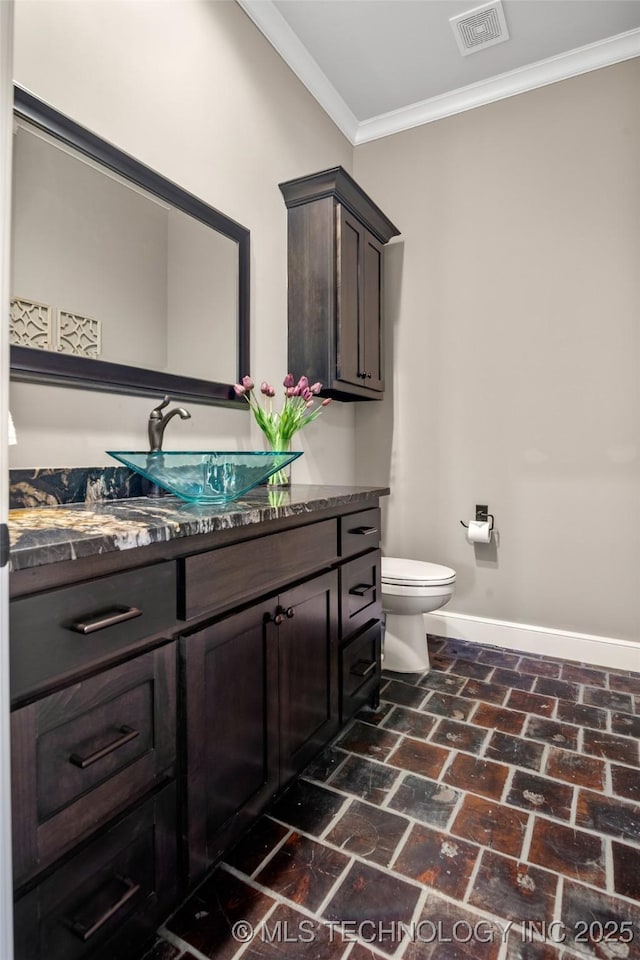 12014 S Kingston Pl, Tulsa, OK 74137 - half bathroom with brick floors, vanity, and ornamental molding