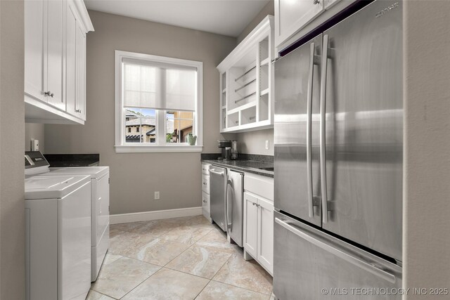 12014 S Kingston Pl, Tulsa, OK 74137 - kitchen featuring stainless steel refrigerator, independent washer and dryer, white cabinetry, dark countertops, and open shelves