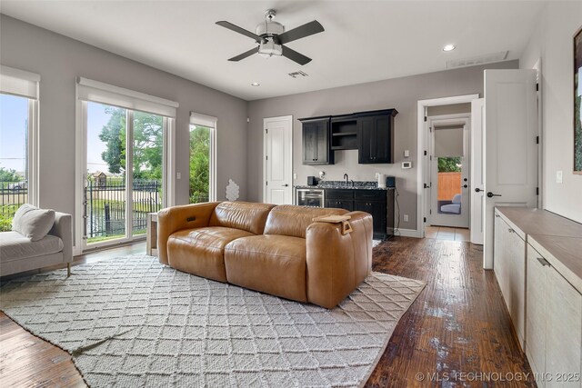 12014 S Kingston Pl, Tulsa, OK 74137 - living room featuring hardwood / wood-style floors, a ceiling fan, recessed lighting, beverage cooler, and bar area