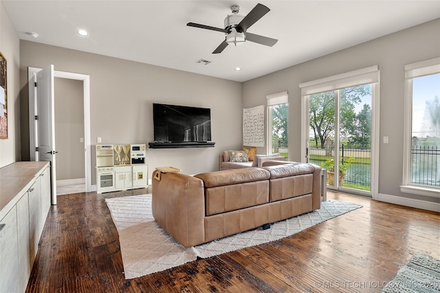 12014 S Kingston Pl, Tulsa, OK 74137 - living room featuring wood-type flooring, a ceiling fan, baseboards, and recessed lighting