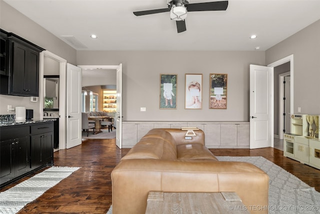 12014 S Kingston Pl, Tulsa, OK 74137 - living area featuring dark wood finished floors, a ceiling fan, and recessed lighting