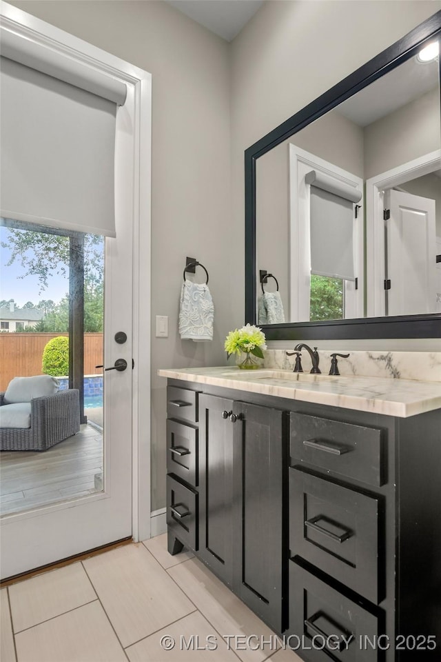 12014 S Kingston Pl, Tulsa, OK 74137 - bathroom with vanity, tile patterned floors, and plenty of natural light