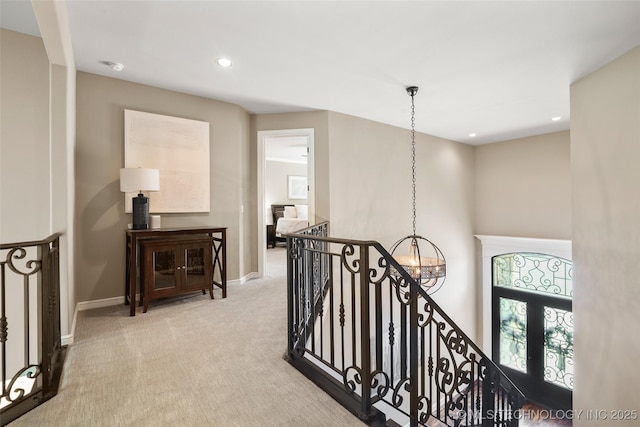 12014 S Kingston Pl, Tulsa, OK 74137 - hall with an upstairs landing, a chandelier, carpet, baseboards, and recessed lighting