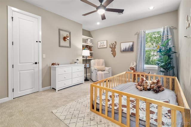 12014 S Kingston Pl, Tulsa, OK 74137 - bedroom featuring recessed lighting, light colored carpet, a nursery area, a ceiling fan, and baseboards