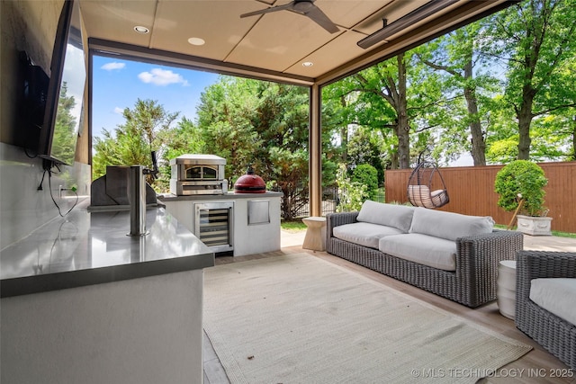 12014 S Kingston Pl, Tulsa, OK 74137 - wooden deck featuring area for grilling, wine cooler, a ceiling fan, and an outdoor hangout area