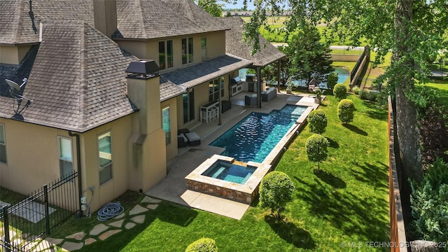 12014 S Kingston Pl, Tulsa, OK 74137 - view of swimming pool featuring a patio, a pool with connected hot tub, and an outdoor hangout area
