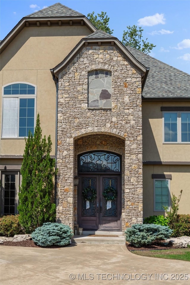 12014 S Kingston Pl, Tulsa, OK 74137 - entrance to property with stucco siding, stone siding, and french doors