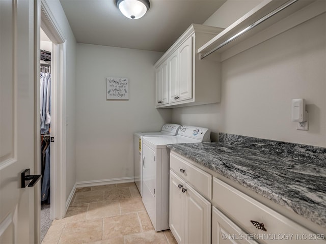 2915 E Rockford Pl, Broken Arrow, OK 74014 - washroom with cabinet space, washing machine and dryer, baseboards, and light stone finish floors