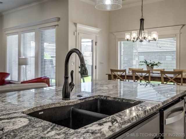 2915 E Rockford Pl, Broken Arrow, OK 74014 - kitchen featuring a sink, stone countertops, crown molding, a chandelier, and plenty of natural light