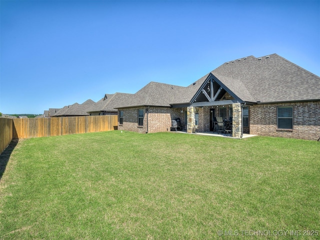 2915 E Rockford Pl, Broken Arrow, OK 74014 - back of property with brick siding, roof with shingles, and a patio