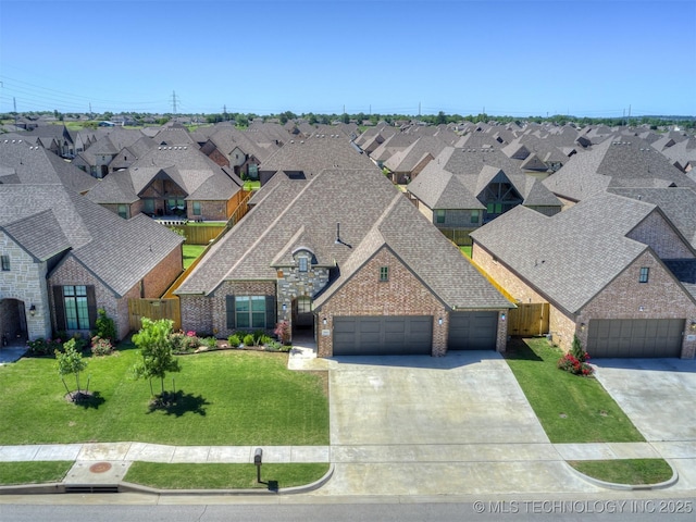 2915 E Rockford Pl, Broken Arrow, OK 74014 - view of front facade featuring a residential view, a garage, driveway, brick siding, and roof with shingles