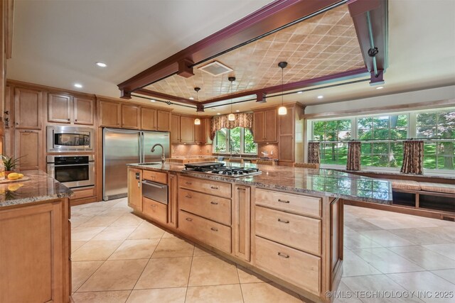 3898 E 72nd St, Tulsa, OK 74136 - kitchen featuring built in appliances, stone countertops, decorative backsplash, a warming drawer, and light tile patterned floors