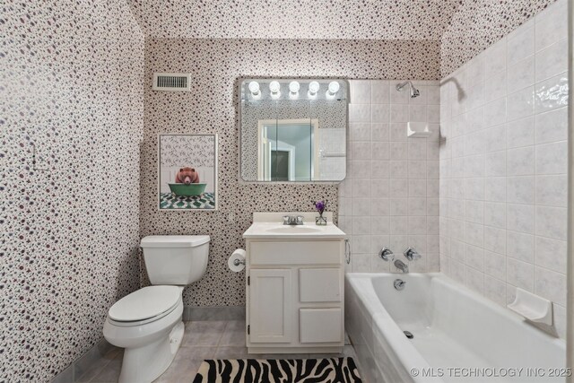 3898 E 72nd St, Tulsa, OK 74136 - bathroom featuring tile patterned floors, vanity, toilet, and shower / bath combination